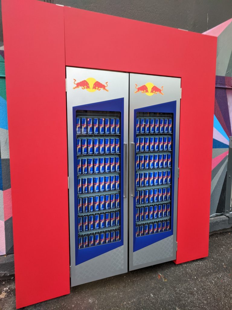 Experiential entry installation for Red Bull “Red Monday” featuring custom fabrication and an engaging welcome moment